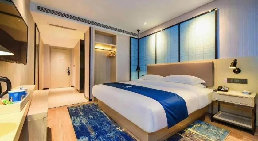 Bed in Echarm Hotel Kunming High-speed Railway South Station Chunrong Street Metro Station