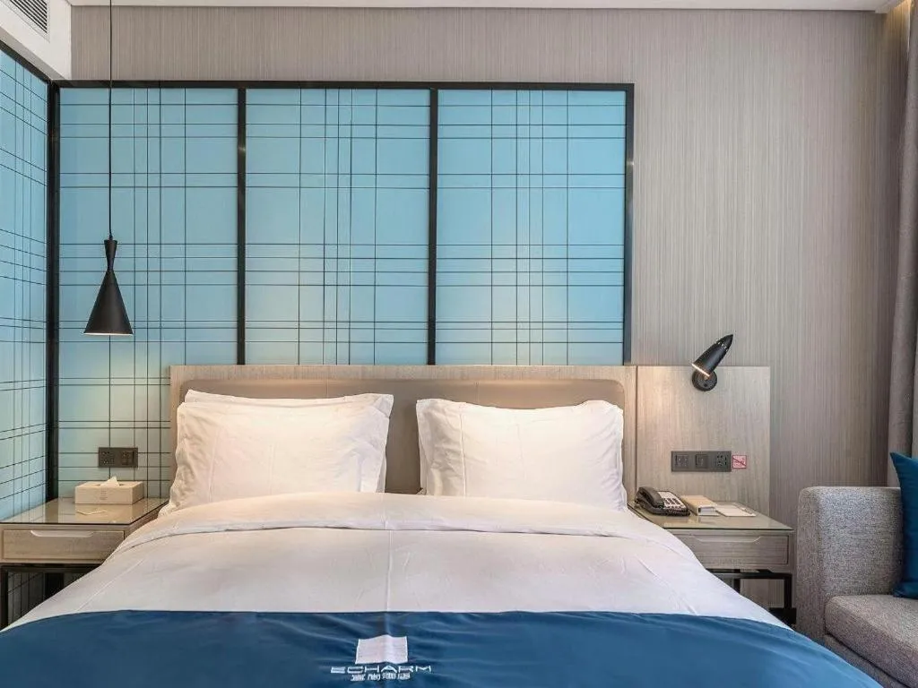 Bed in Echarm Hotel Kunming High-speed Railway South Station Chunrong Street Metro Station