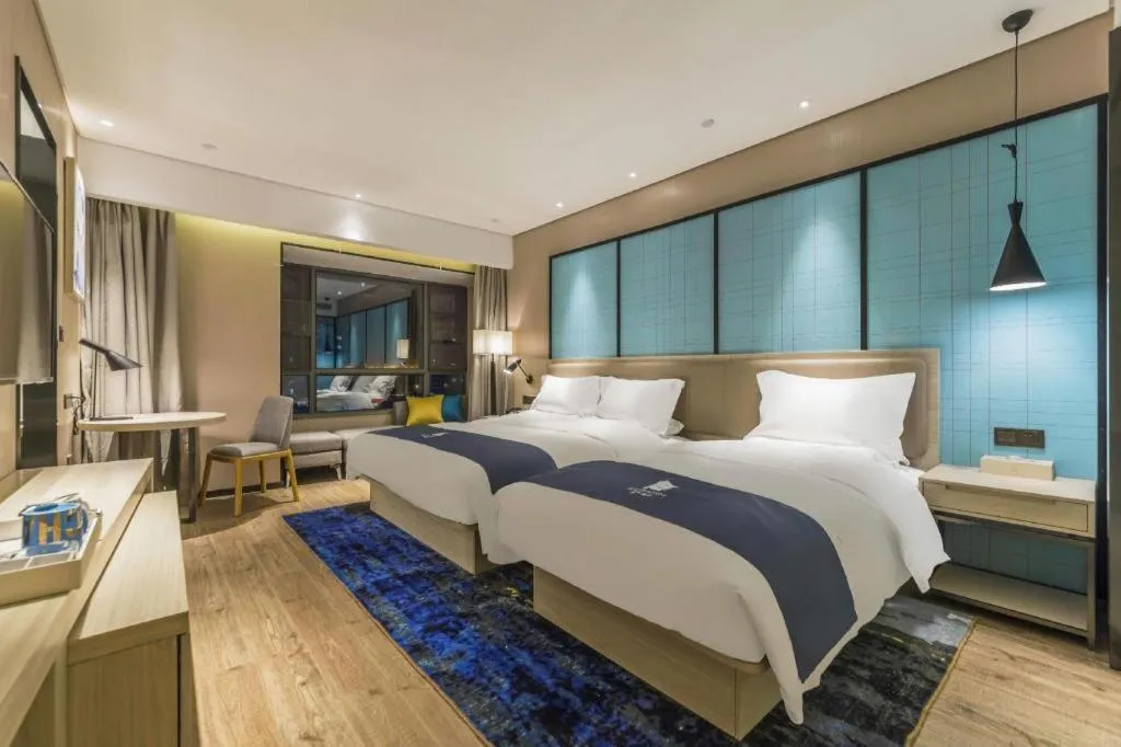 Bed in Echarm Hotel Kunming High-speed Railway South Station Chunrong Street Metro Station