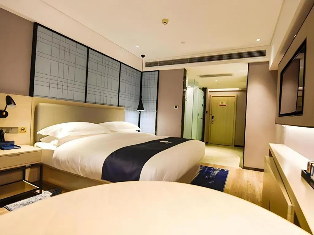 Bed in Echarm Hotel Kunming High-speed Railway South Station Chunrong Street Metro Station
