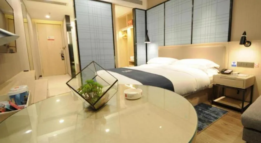 Bed in Echarm Hotel Kunming High-speed Railway South Station Chunrong Street Metro Station