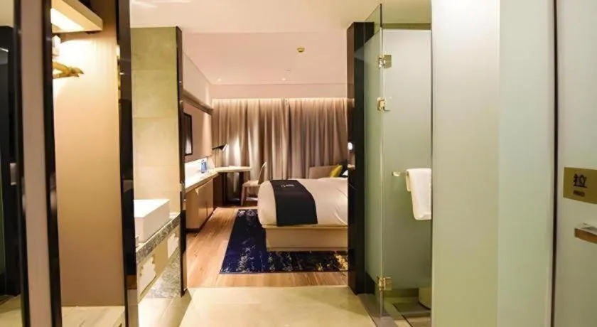 Bed in Echarm Hotel Kunming High-speed Railway South Station Chunrong Street Metro Station