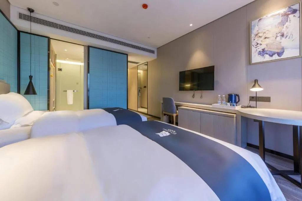 Bed in Echarm Hotel Kunming High-speed Railway South Station Chunrong Street Metro Station