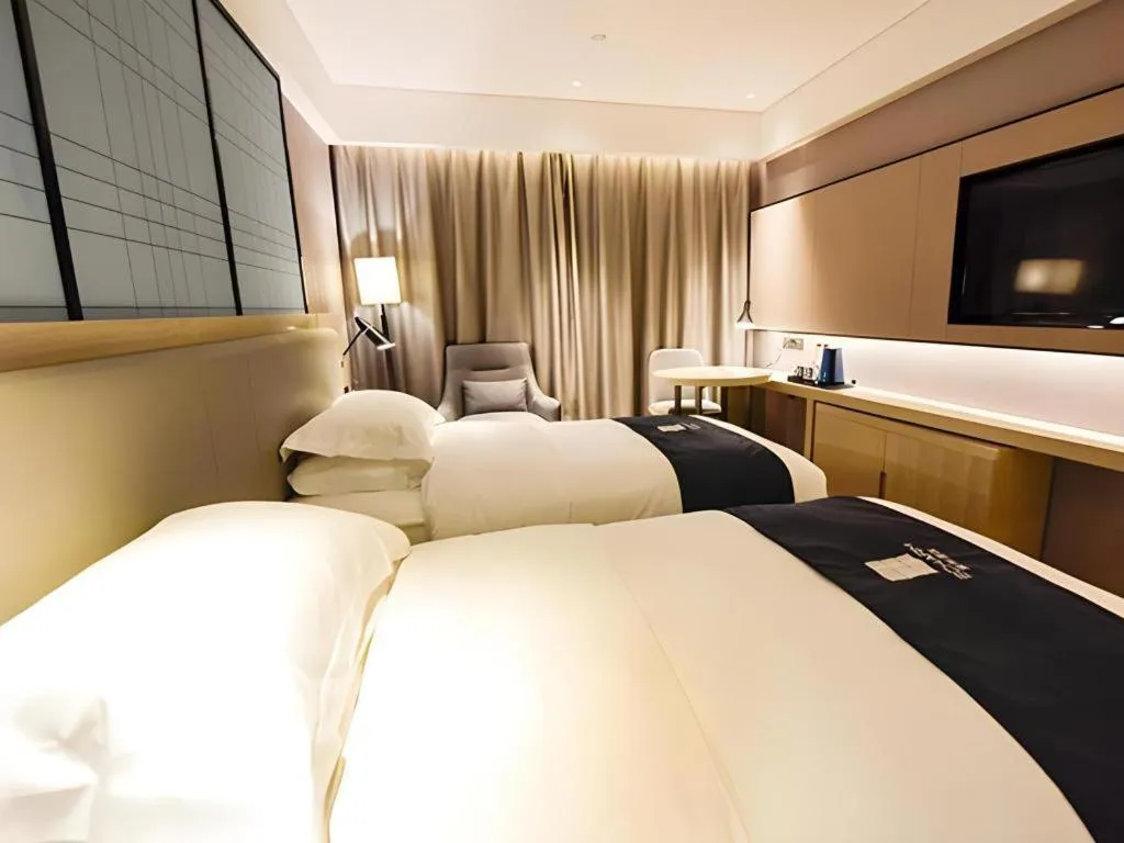 Bed in Echarm Hotel Kunming High-speed Railway South Station Chunrong Street Metro Station