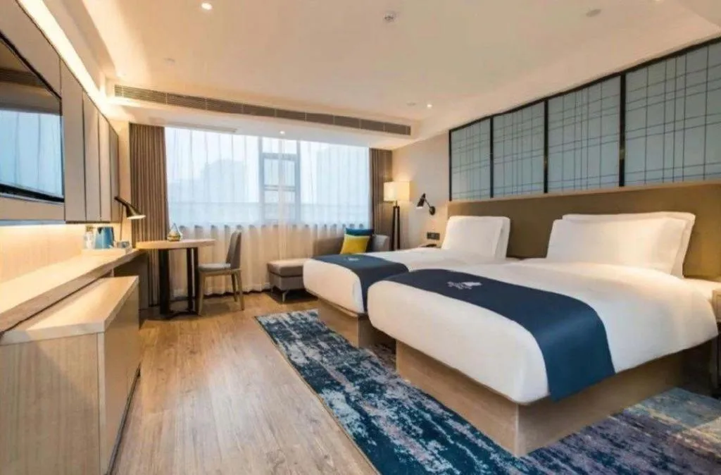 Bed in Echarm Hotel Kunming High-speed Railway South Station Chunrong Street Metro Station