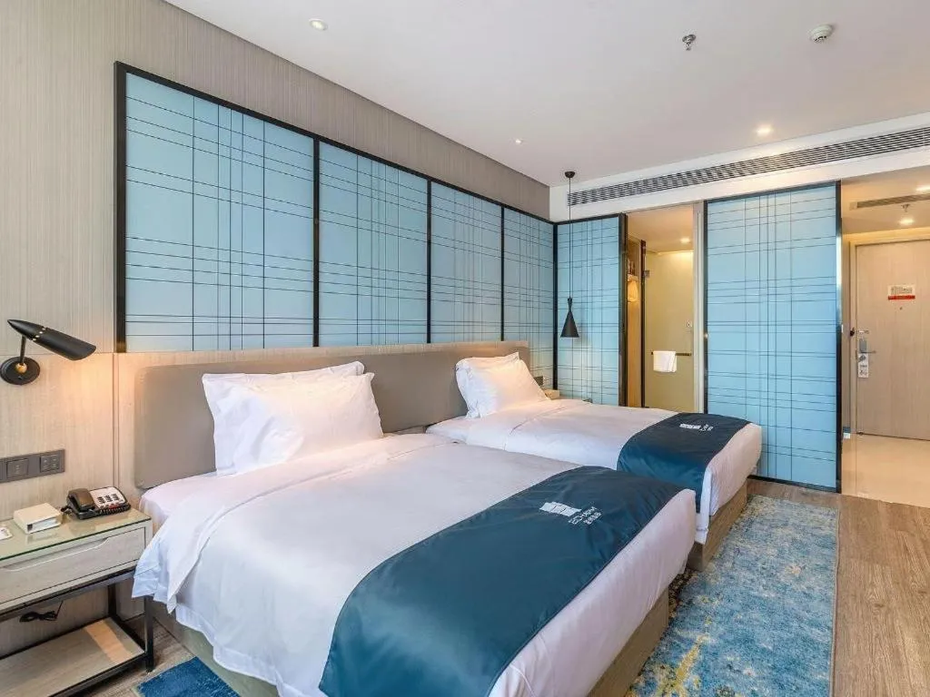 Bed in Echarm Hotel Kunming High-speed Railway South Station Chunrong Street Metro Station