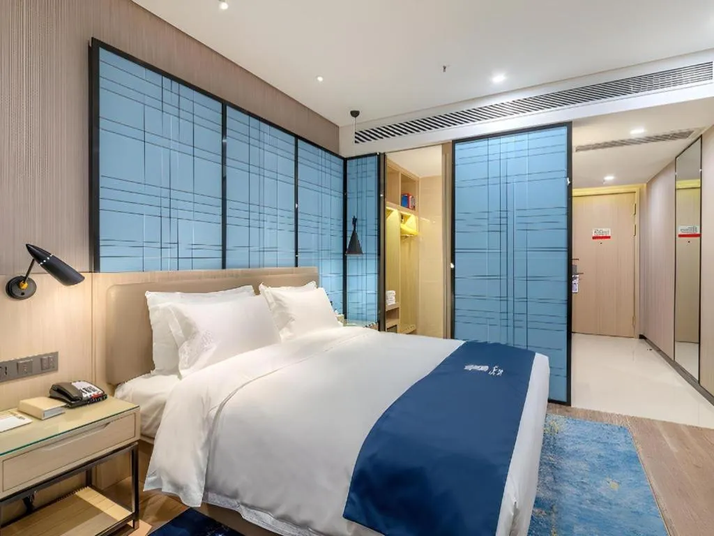 Bed in Echarm Hotel Kunming High-speed Railway South Station Chunrong Street Metro Station