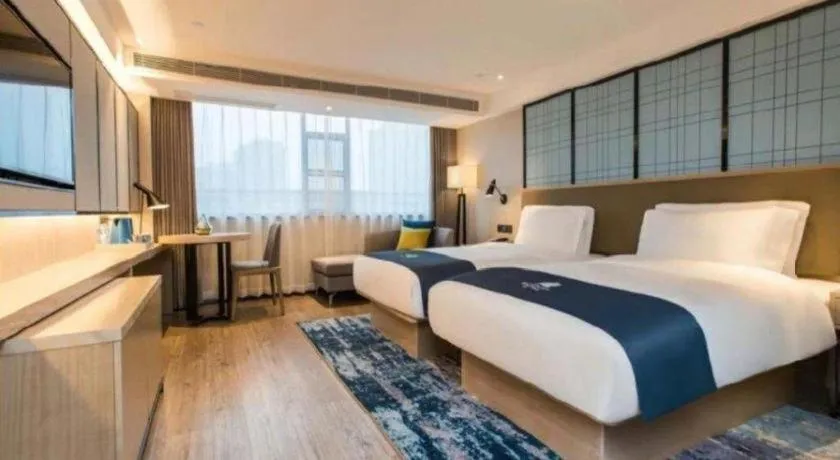 Bed in Echarm Hotel Kunming High-speed Railway South Station Chunrong Street Metro Station