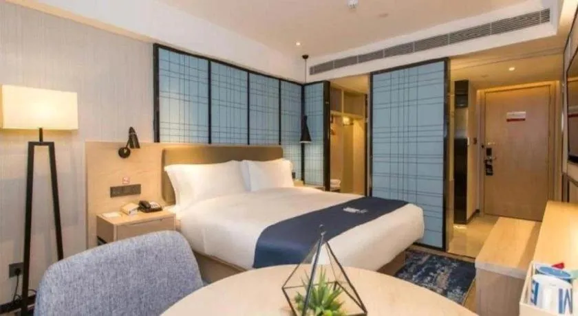 Bed in Echarm Hotel Kunming High-speed Railway South Station Chunrong Street Metro Station