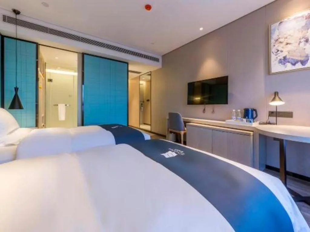 Bed in Echarm Hotel Kunming High-speed Railway South Station Chunrong Street Metro Station