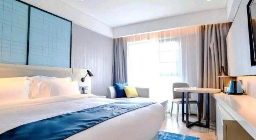 Bed in Echarm Hotel Kunming High-speed Railway South Station Chunrong Street Metro Station