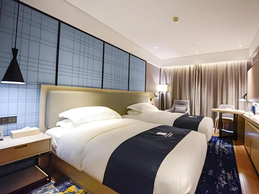 Bed in Echarm Hotel Kunming High-speed Railway South Station Chunrong Street Metro Station