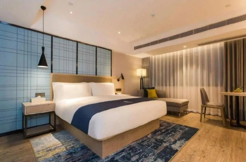 Bed in Echarm Hotel Kunming High-speed Railway South Station Chunrong Street Metro Station