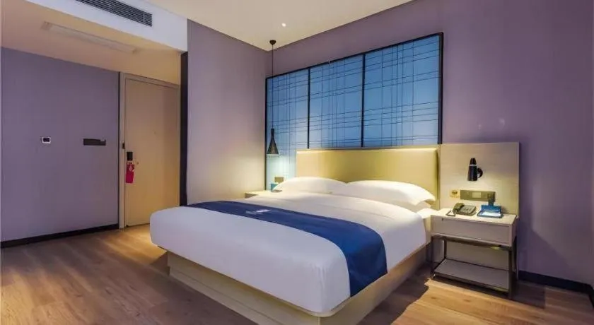 Bed in Echarm Hotel Guiyang Qianling Mountain