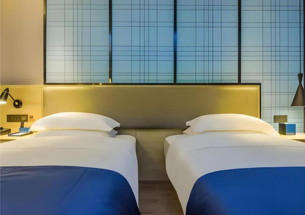 Bed in Echarm Hotel Guiyang Qianling Mountain