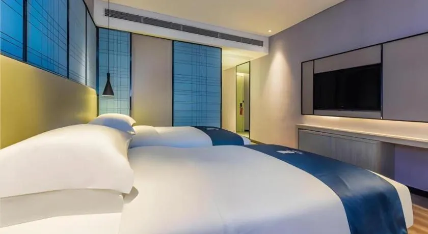 Bed in Echarm Hotel Guiyang Qianling Mountain