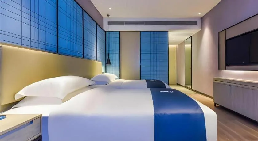 Bed in Echarm Hotel Guiyang Qianling Mountain