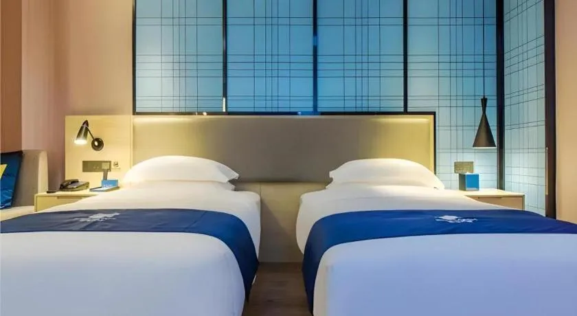 Bed in Echarm Hotel Guiyang Qianling Mountain