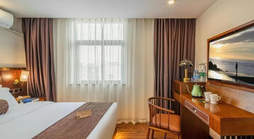 Bed in James Joyce Coffetel Guilin Railway Station Xiangbi Mountain Liangjiang Sihu Wharf