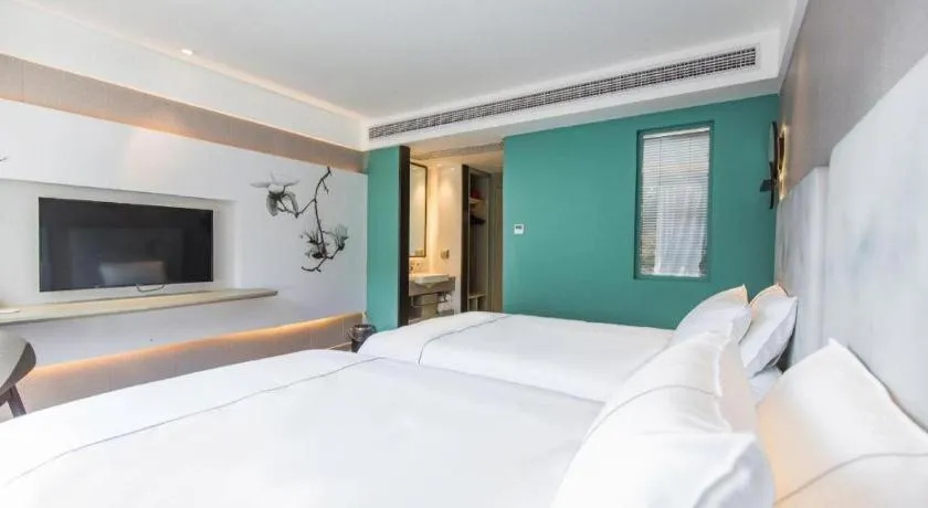 Bed in Magnotel Hotel Huangshan Scenic Area Transfer Center