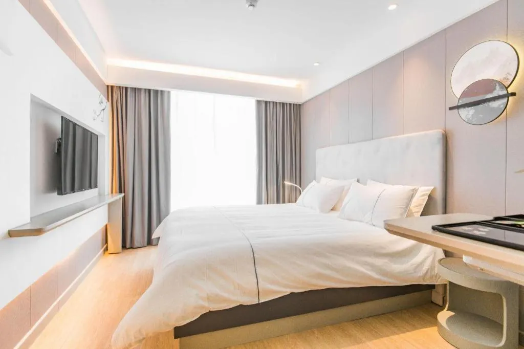 Bed in Magnotel Hotel Huangshan Scenic Area Transfer Center