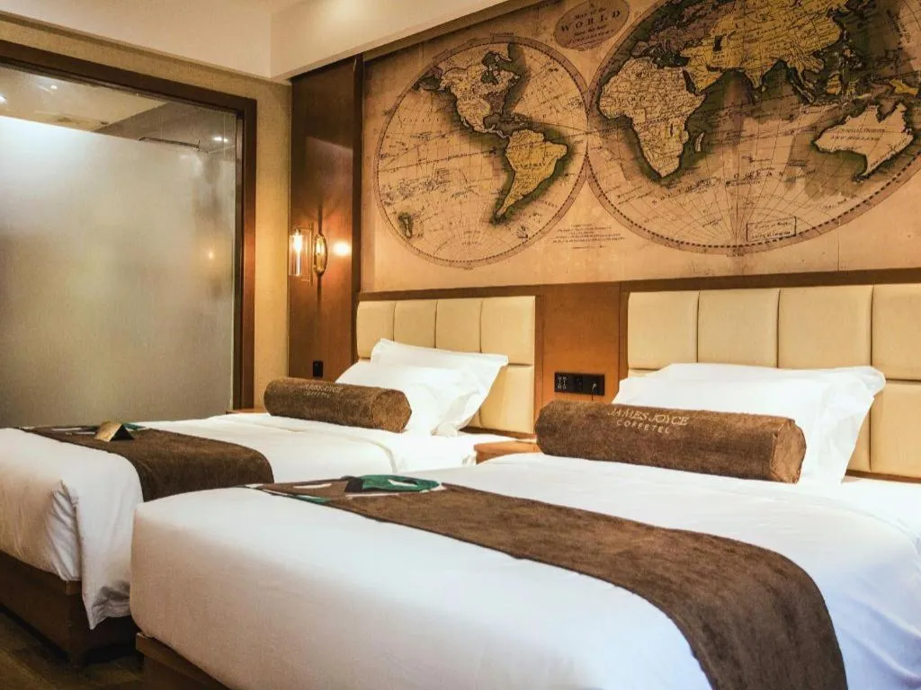 Bed in James Joyce Coffetel Xinyang Municipal Government Railway Station