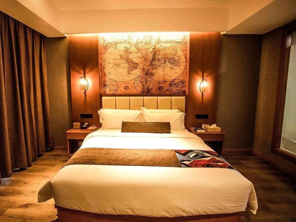 Bed in James Joyce Coffetel Xinyang Municipal Government Railway Station