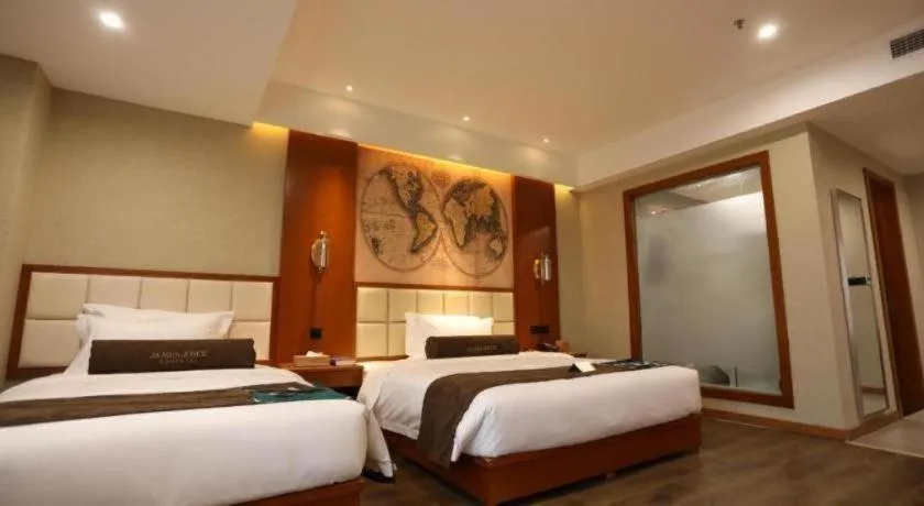 Bed in James Joyce Coffetel Xinyang Municipal Government Railway Station