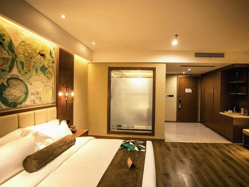 Bed in James Joyce Coffetel Xinyang Municipal Government Railway Station