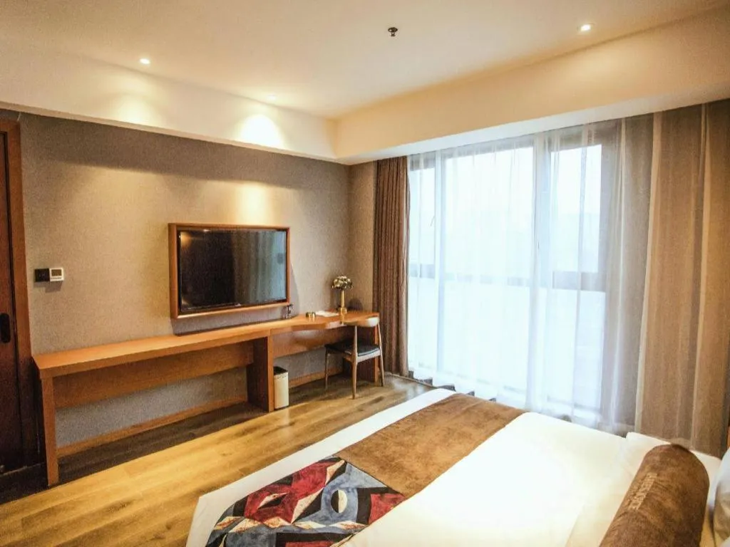 Bed in James Joyce Coffetel Xinyang Municipal Government Railway Station