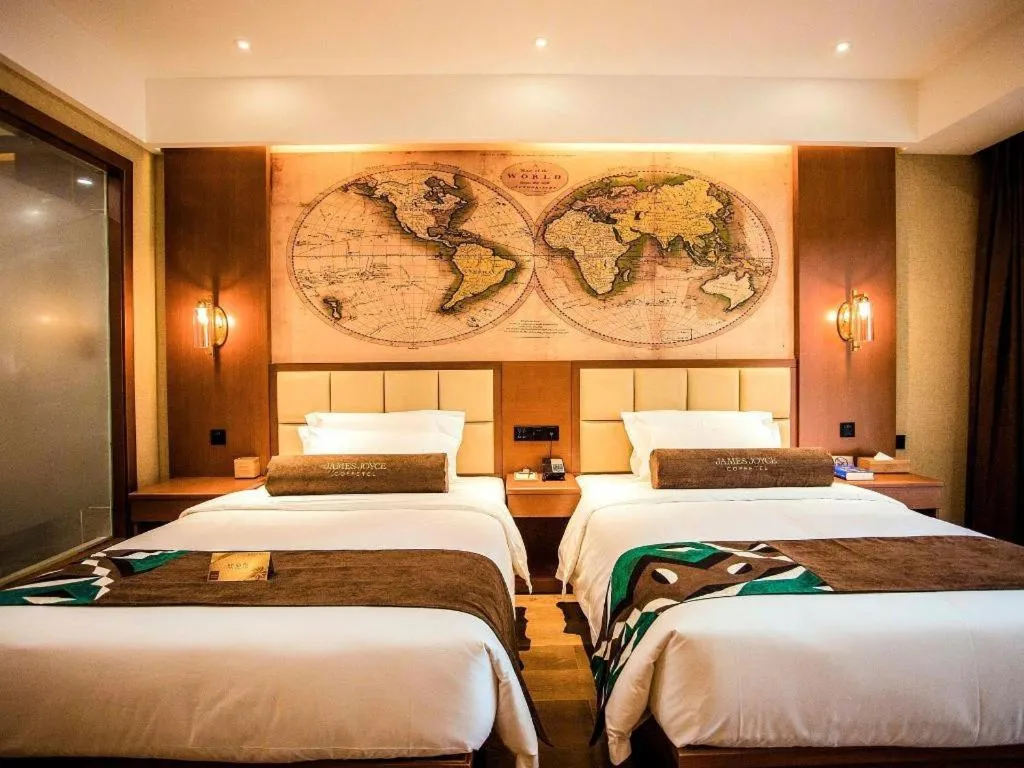 Bed in James Joyce Coffetel Xinyang Municipal Government Railway Station