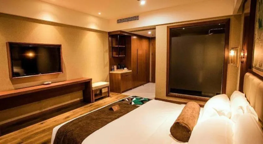 Bed in James Joyce Coffetel Xinyang Municipal Government Railway Station