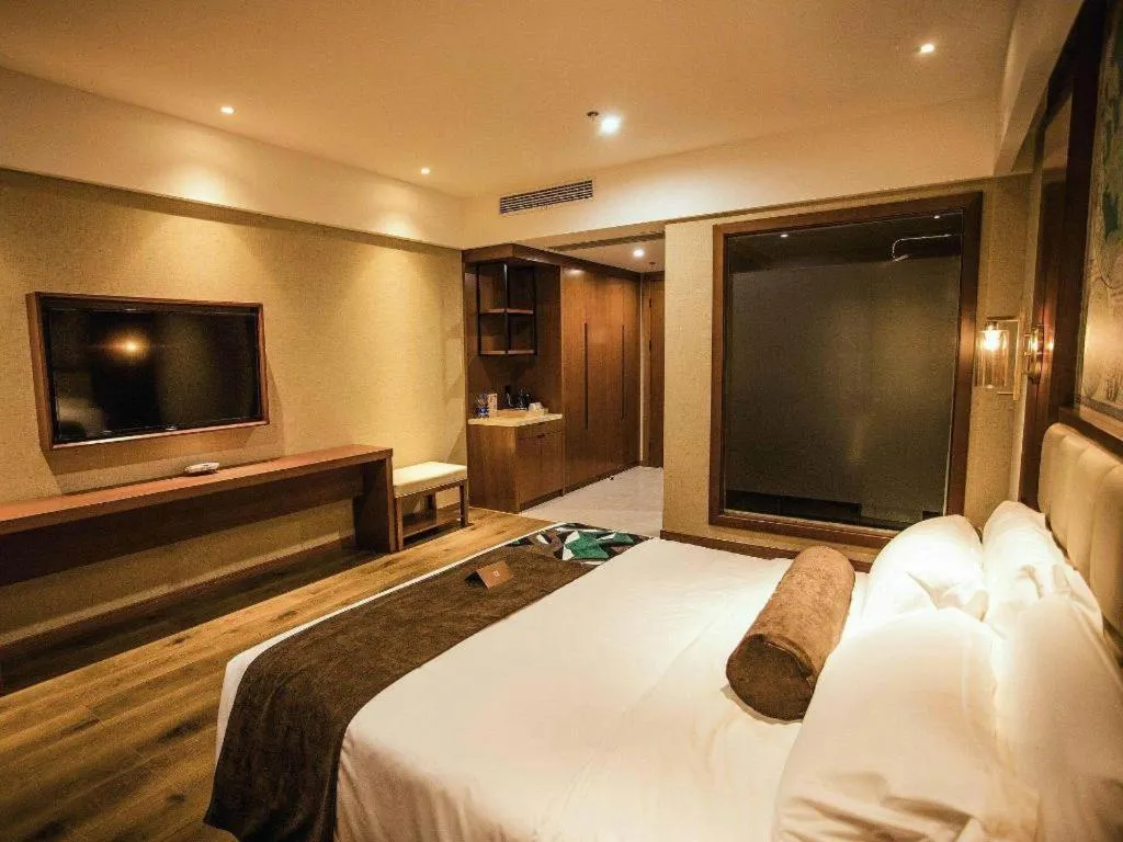 Bed in James Joyce Coffetel Xinyang Municipal Government Railway Station