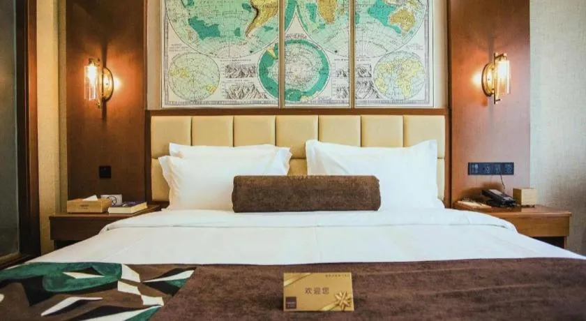 Bed in James Joyce Coffetel Xinyang Municipal Government Railway Station