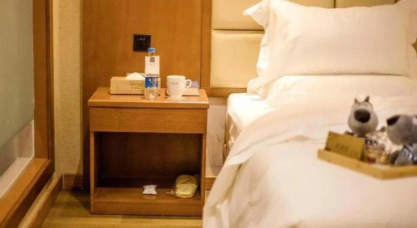 Bed in James Joyce Coffetel Xinyang Municipal Government Railway Station