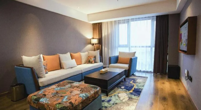 Bed in James Joyce Coffetel Xinyang Municipal Government Railway Station