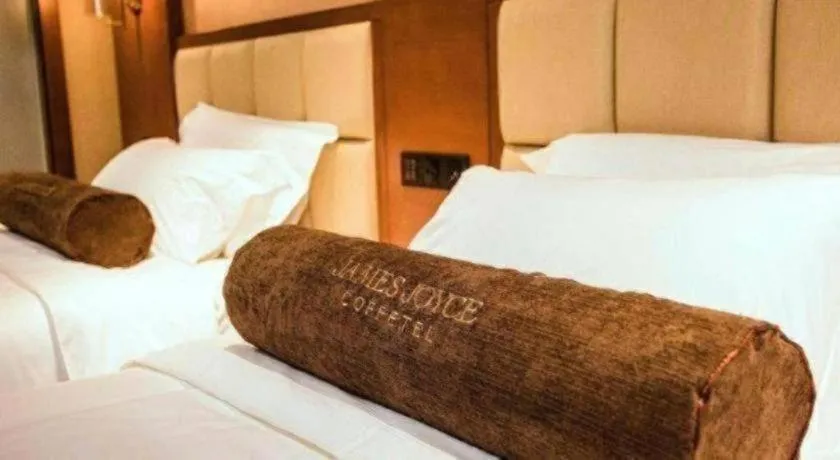 Bed in James Joyce Coffetel Xinyang Municipal Government Railway Station