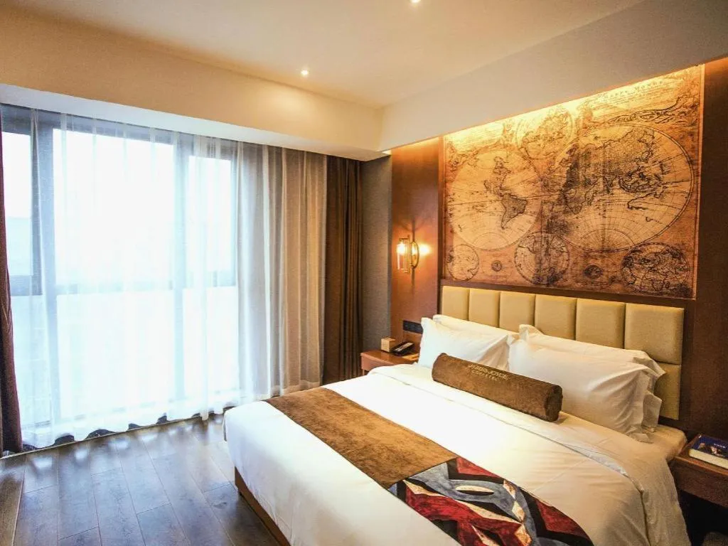 Bed in James Joyce Coffetel Xinyang Municipal Government Railway Station