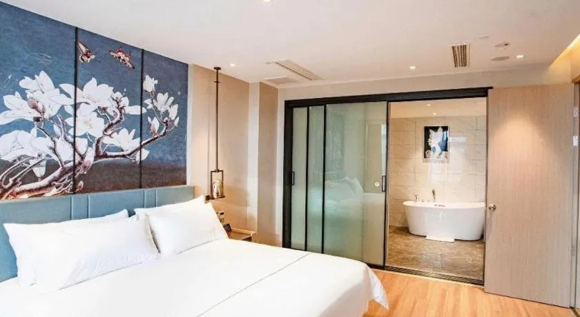 Bed in Magnotel Hotel Guangyuan Nanhe Bus Station Beijing Road