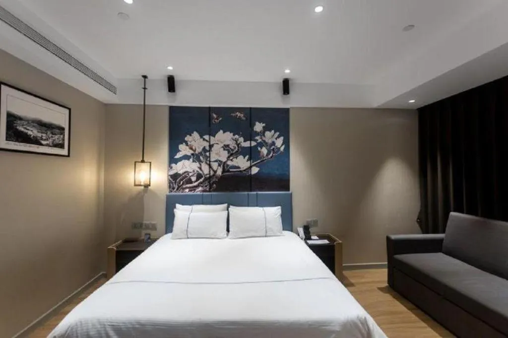 Bed in Magnotel Hotel Guangyuan Nanhe Bus Station Beijing Road