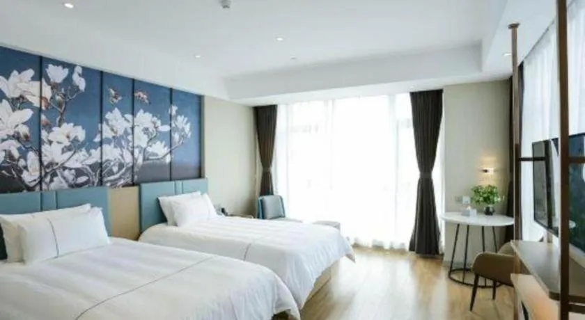 Bed in Magnotel Hotel Guangyuan Nanhe Bus Station Beijing Road