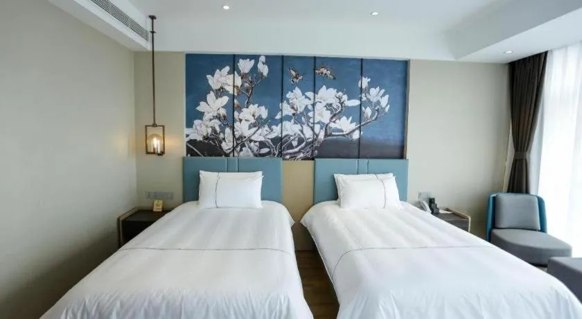 Bed in Magnotel Hotel Guangyuan Nanhe Bus Station Beijing Road