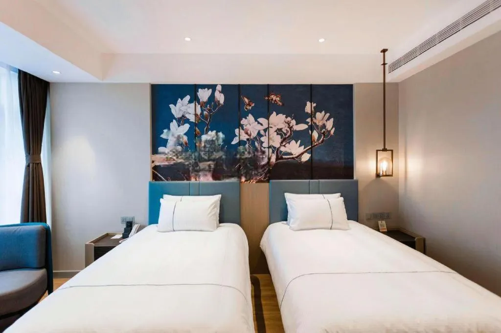 Bed in Magnotel Hotel Guangyuan Nanhe Bus Station Beijing Road