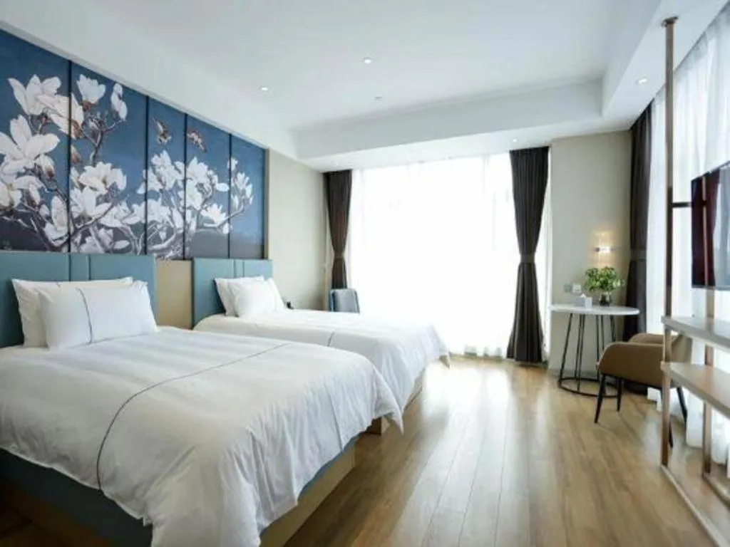 Bed in Magnotel Hotel Guangyuan Nanhe Bus Station Beijing Road