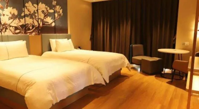 Bed in Magnotel Hotel Guangyuan Nanhe Bus Station Beijing Road