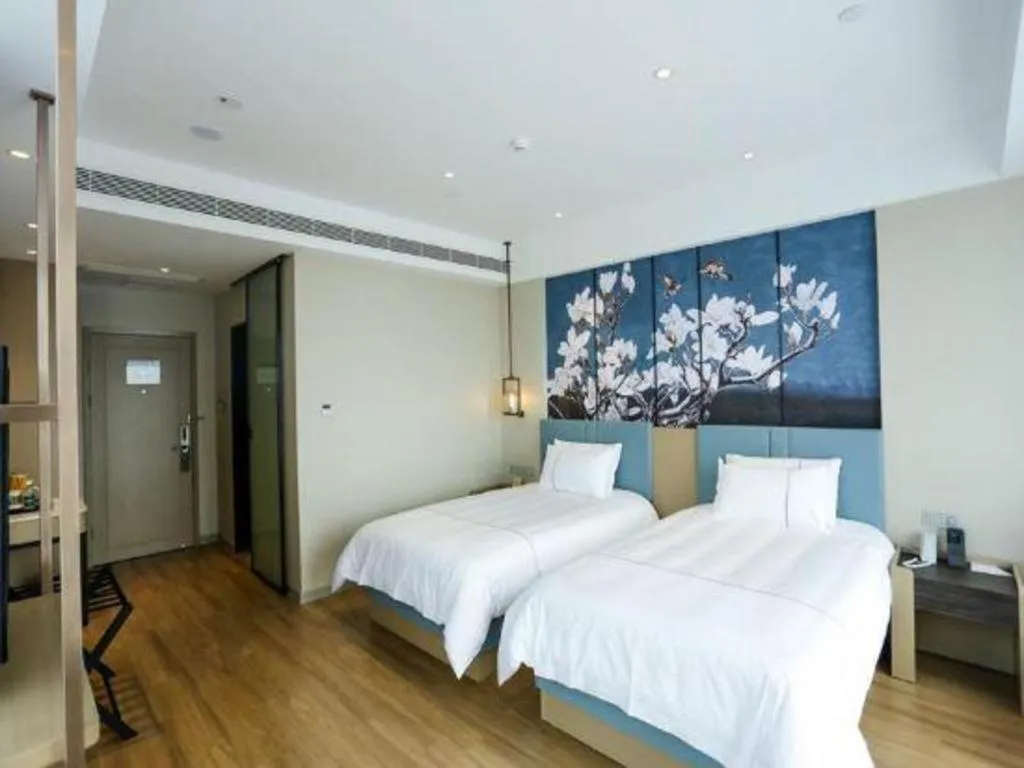 Bed in Magnotel Hotel Guangyuan Nanhe Bus Station Beijing Road