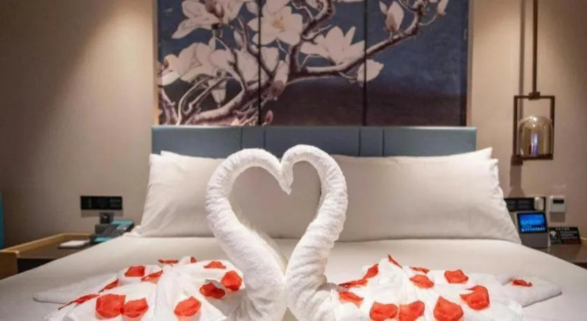 Bed in Magnotel Hotel Guangyuan Nanhe Bus Station Beijing Road