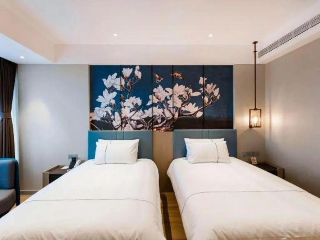 Bed in Magnotel Hotel Guangyuan Nanhe Bus Station Beijing Road