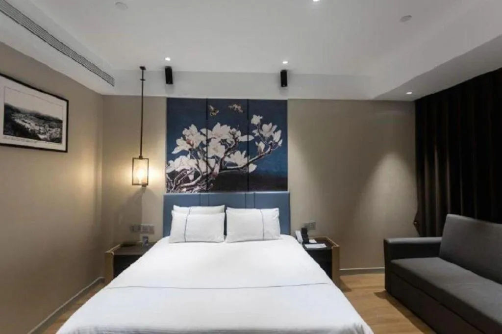 Bed in Magnotel Hotel Guangyuan Nanhe Bus Station Beijing Road