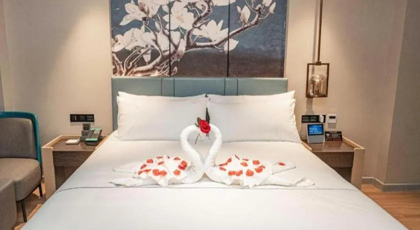 Bed in Magnotel Hotel Guangyuan Nanhe Bus Station Beijing Road